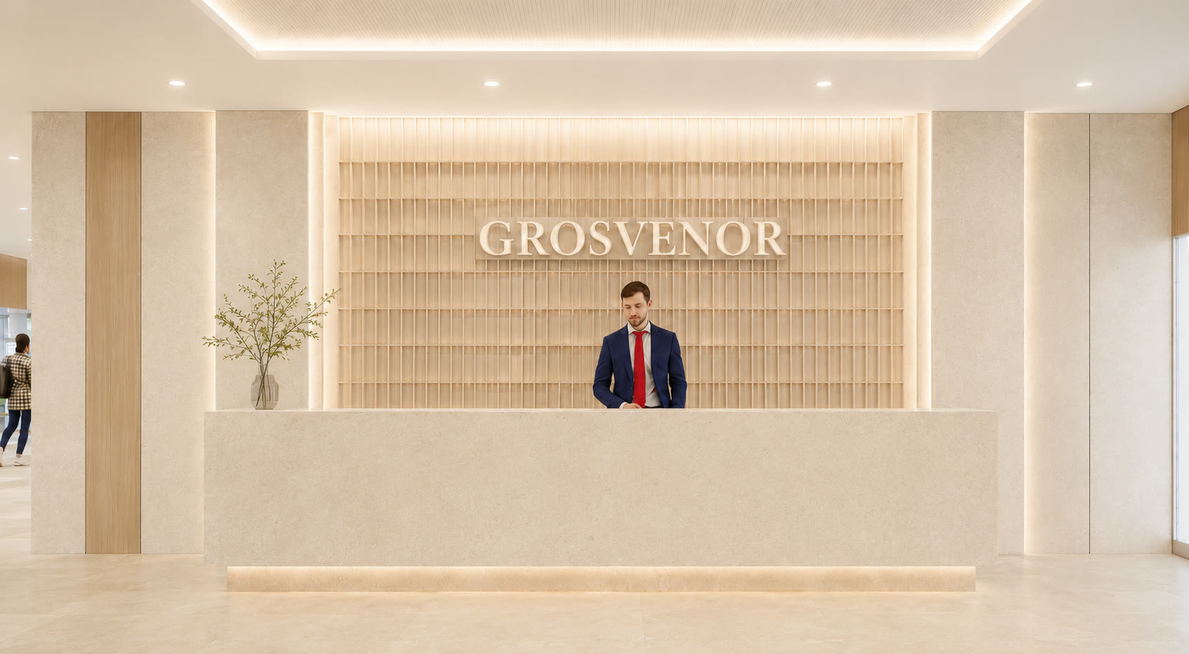 Limestone reception desk in front of a backlit oak screen carrying the Grosvenor name